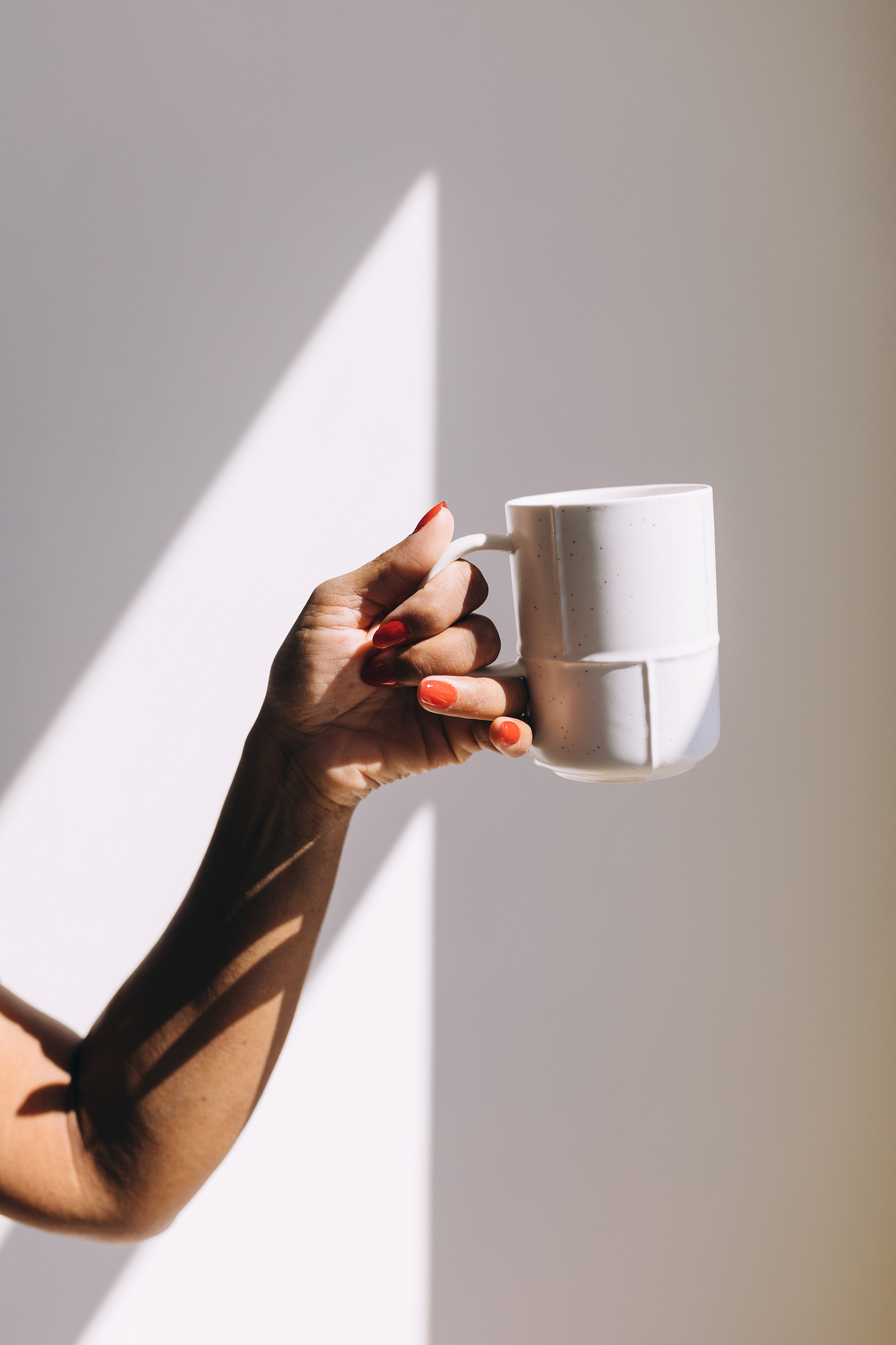 Image of Arm Carrying a Mug